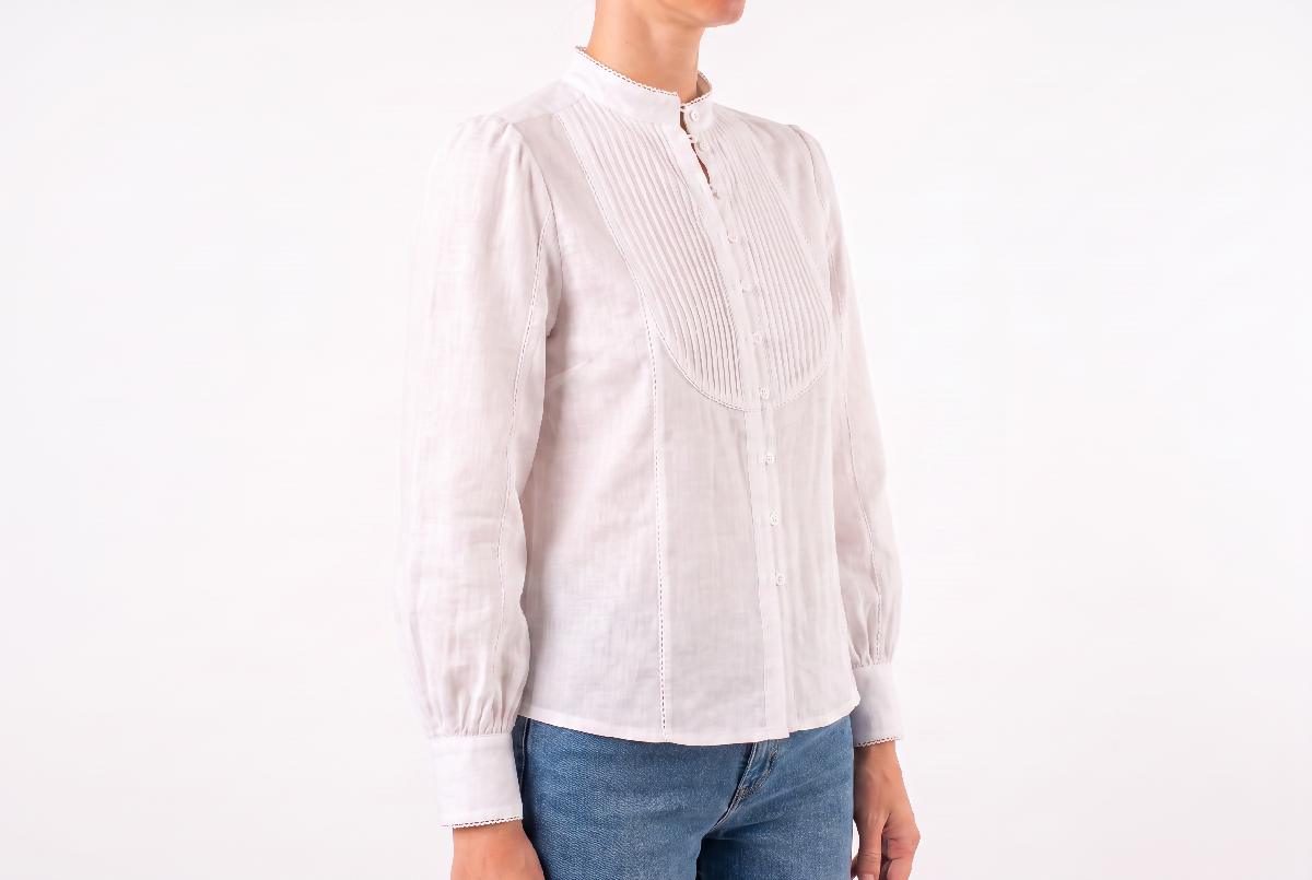 Generated with Kive.ai - Recompose Image 1 as a refined editorial three-quarter front view_ angled slightly to reveal the blouse's front and a small portion of the jeans worn below th