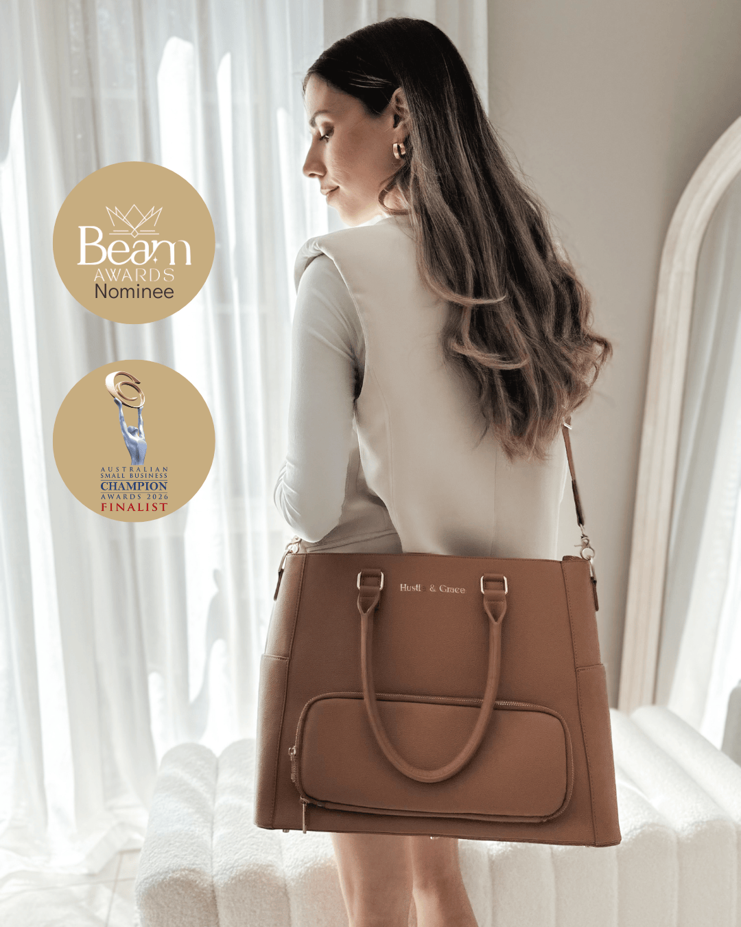 Woman carrying Iluka Executive Tote in Driftwood — luxury vegan corporate tote for professional women