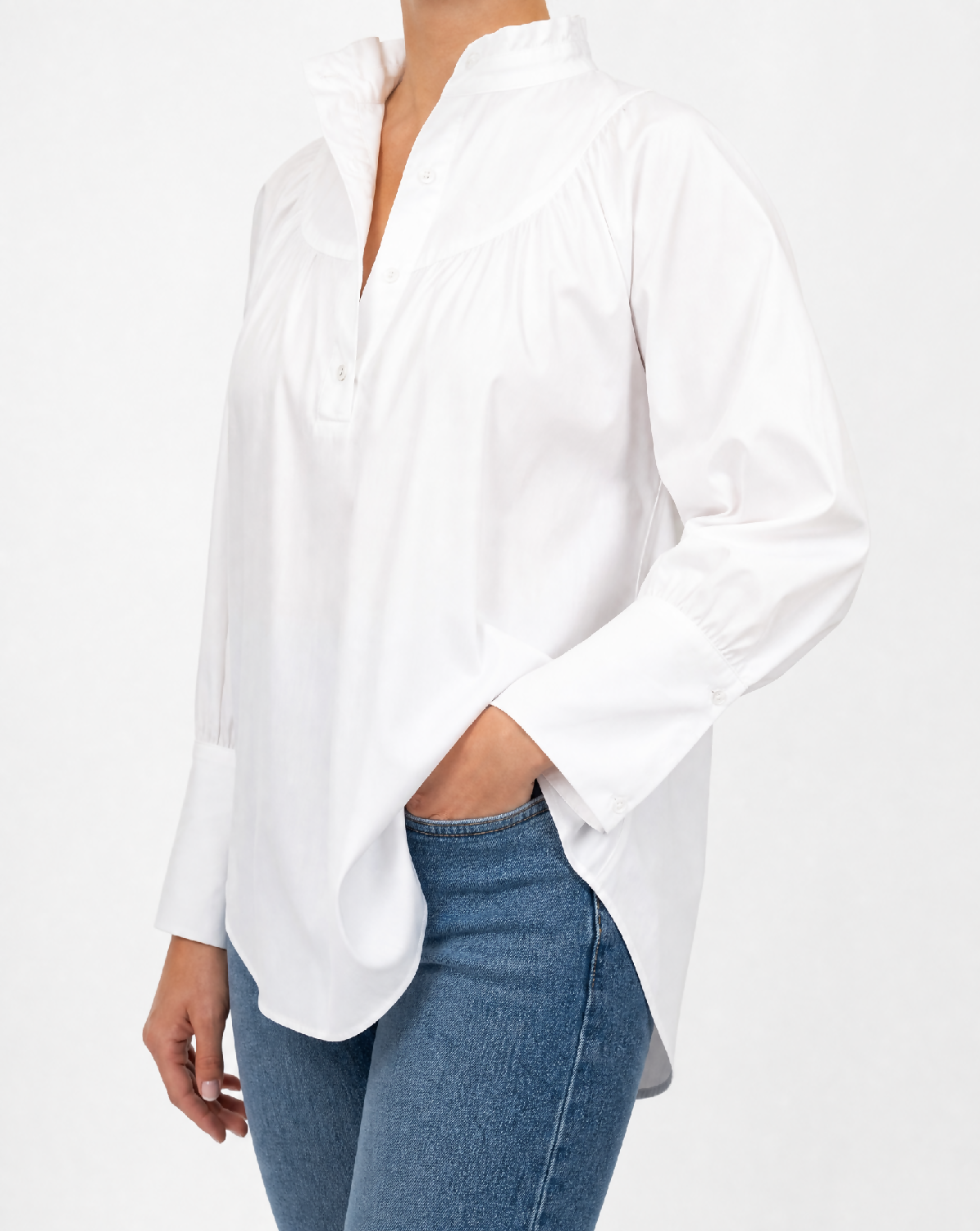 Generated with Kive.ai - White gathered-collar shirt_ exact shirt identity. Polished editorial fashion photograph_ cropped from below the neck to mid-thigh so no face or facial fe (1)
