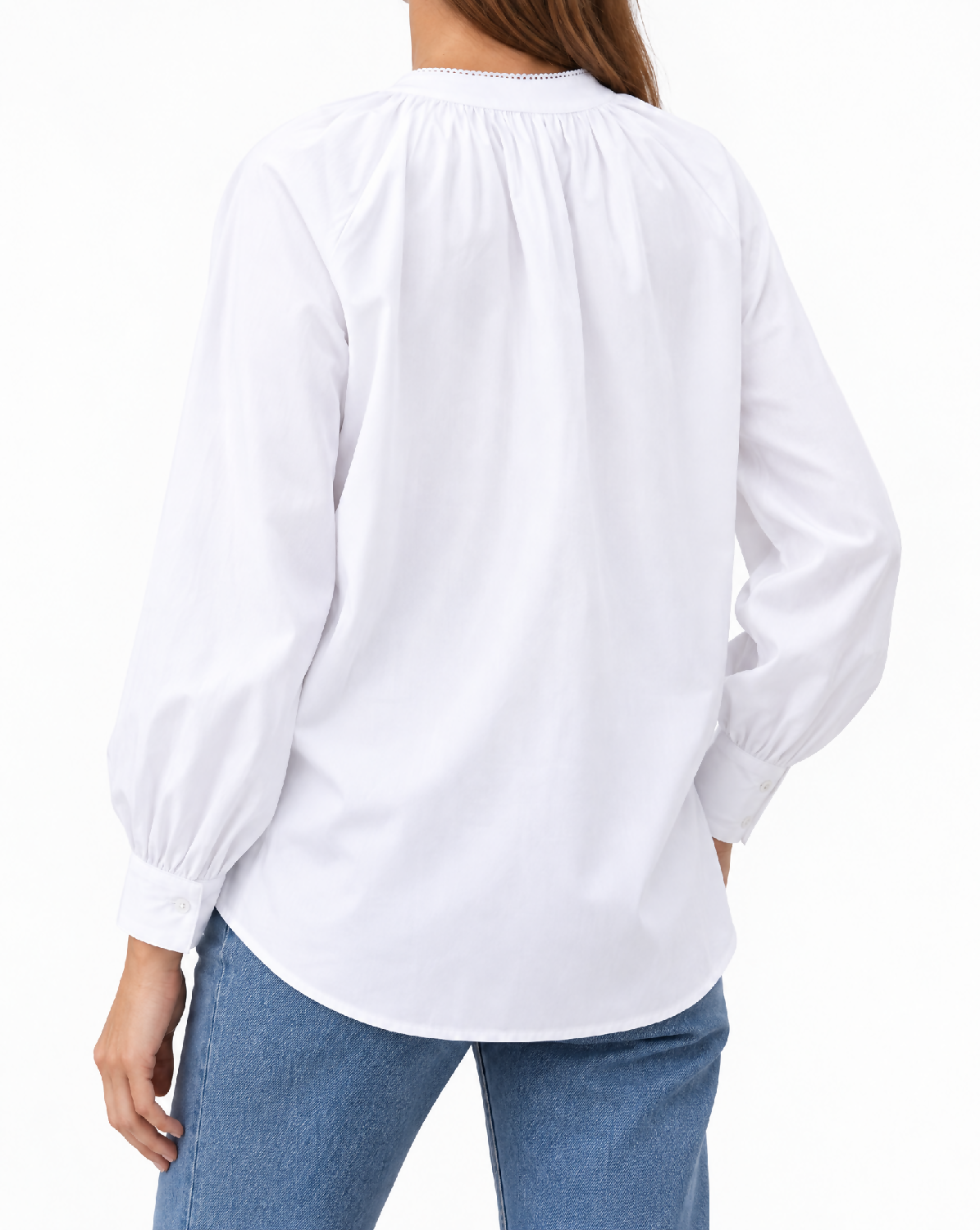 Generated with Kive.ai - Image 1_ Image 2_ and Image 3 define the exact white blouse identity and garment details_ including its gathered neckline_ relaxed back_ long sleeves_ and gathered button cuffs. Image 4 provides o