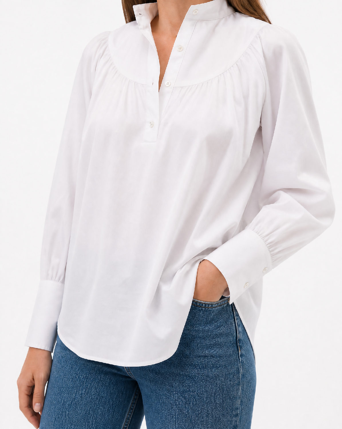 Generated with Kive.ai - White gathered-collar shirt_ exact shirt identity. Refined editorial detail portrait cropped from below the neck to the upper thighs so no face or facial feat
