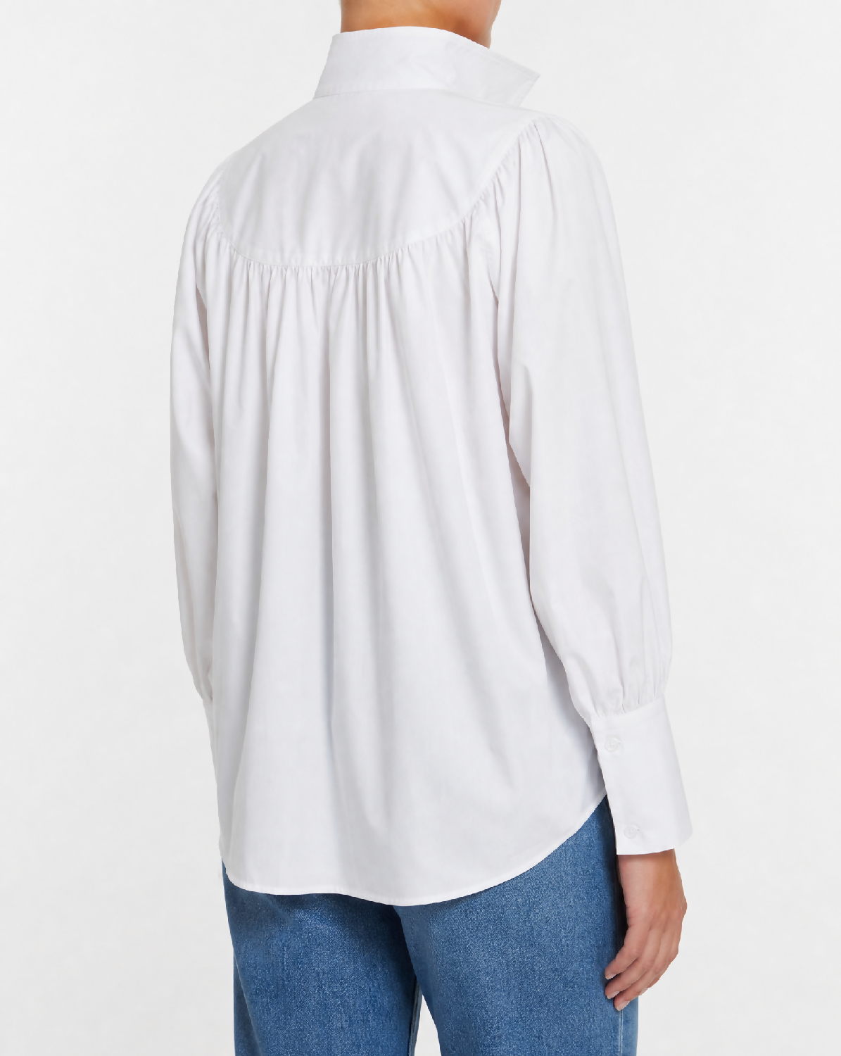 Generated with Kive.ai - White gathered-collar shirt_ exact shirt identity. Polished editorial fashion photograph_ cropped from below the neck to mid-thigh so no face or facial fe (2)