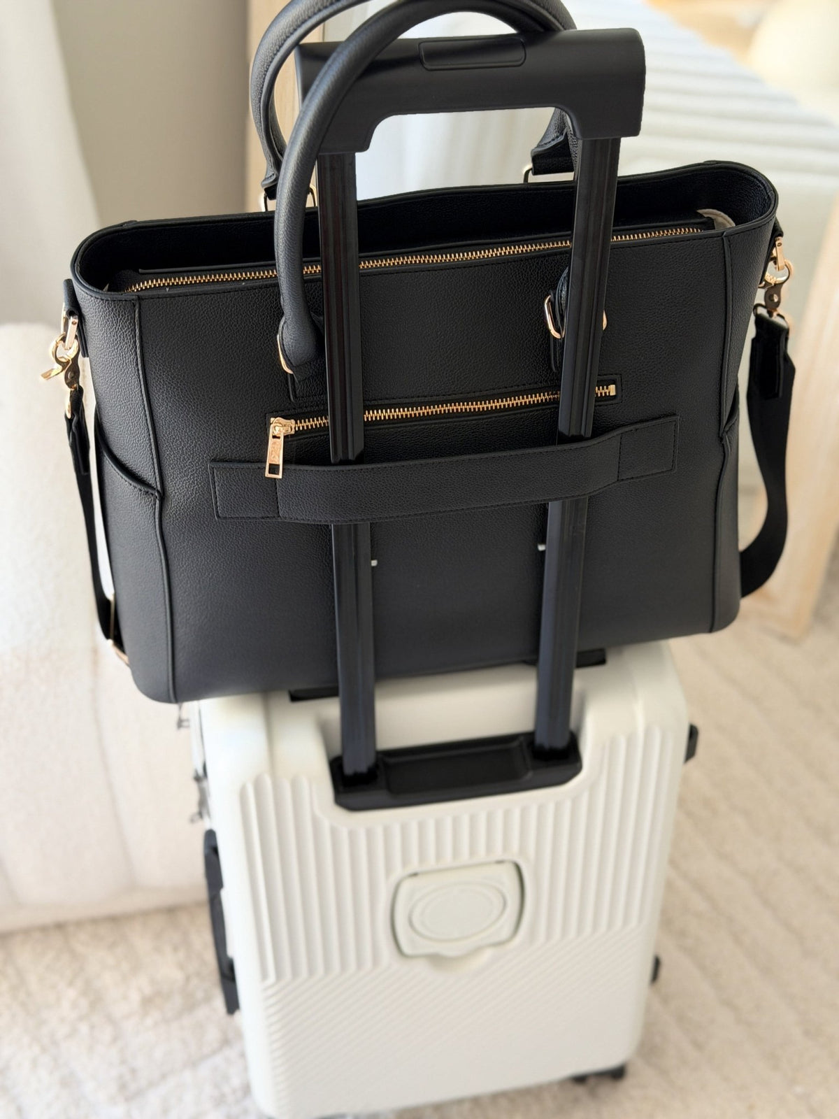 Back view of the Charcoal Iluka Executive Tote showing trolley sleeve for airport travel