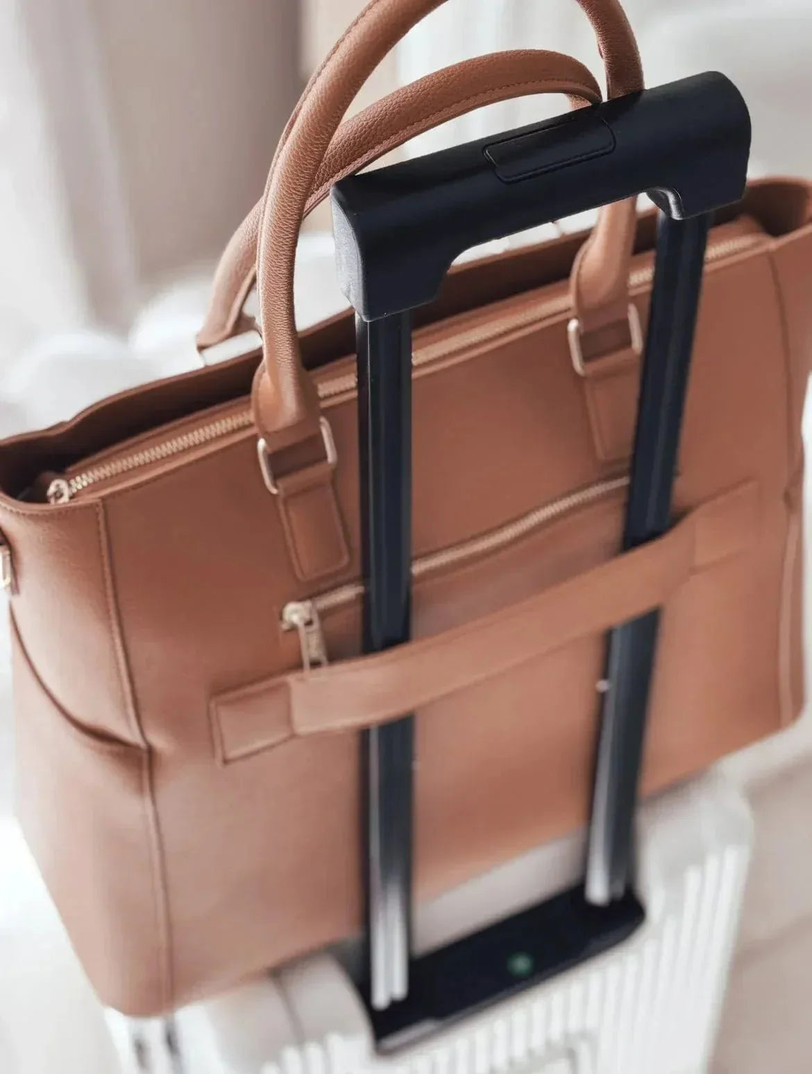 Back view of the Driftwood Iluka Executive Tote showing trolley sleeve for airport travel